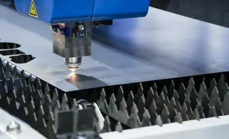 Fiber laser cutting metal sheet with sparks