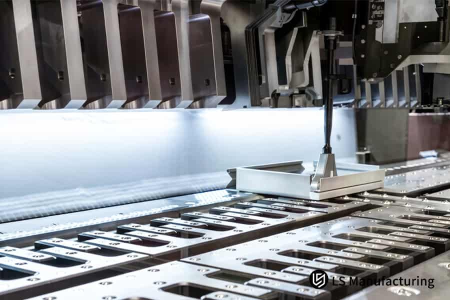 A press stamps a 1.2mm thick aluminum sheet into an L-bracket for automotive component assembly.